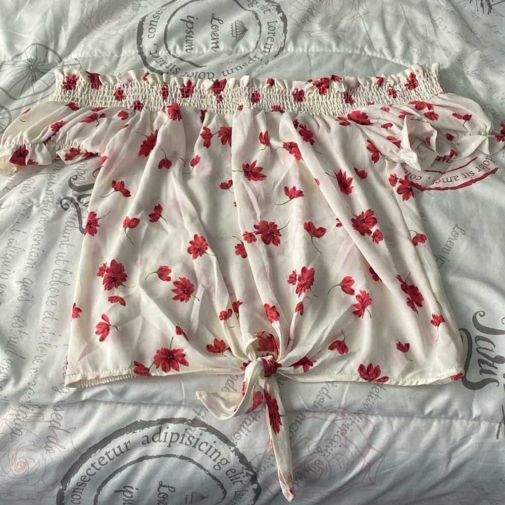 Over-the-shoulder, floral and dressy top.